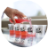 A pink reduced sugar soda being poured into a line of several small ADM branded tasting glasses.