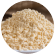 Soybean meal in a bowl with raw soybeans around