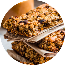 Two nutrition bars stacked on top one another.
