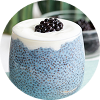A glass of a blue spirulina and blackberry smoothie