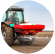 A farmer fertilizing a field